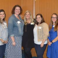 Group shot of alumni posing for a photo